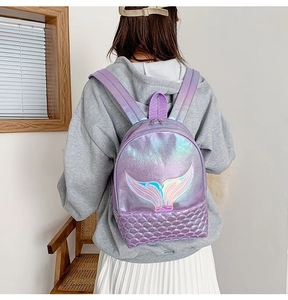 Detail of the holographic mermaid backpack with fish scale texture and iridescent tail