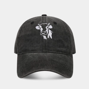 Washed dark grey baseball cap featuring detailed white cow embroidery in a classic design