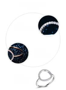 Macro details of S925 sterling silver ring with pavé zircons and hollow circular design