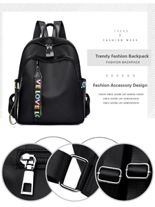 Close-up of zipper durability and reinforced metal buckle on black Oxford backpack