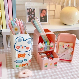 Detailed view of fridge-shaped desk organizers in pink and white with cute stickers