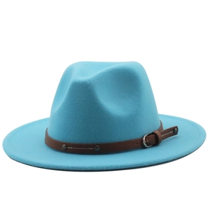 Detail view of sky blue wool fedora hat with brown leather studded band and silver buckle