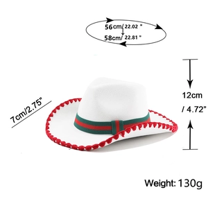 White cowboy hat detail with red pom-poms and striped band showing 56-58cm size