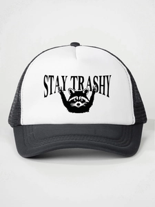 Detail of Stay Trashy raccoon print on a black and white mesh trucker snapback hat