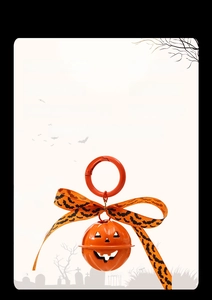 Detail of Halloween pumpkin bell keychain with orange ribbon and 4.0x8.5cm size specs