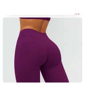 Detail of high waisted purple yoga pants featuring V-shaped stitching for booty lift effect