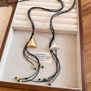 Minimalist double-layered leather cord necklace with matte geometric triangle pendants