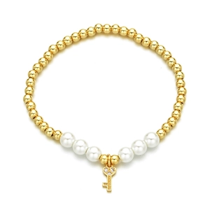 Beaded bracelet with golden beads, white pearls, and a diamond-studded key charm