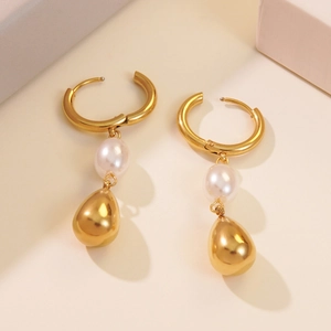 Golden teardrop drop earrings with white pearls made of durable stainless steel