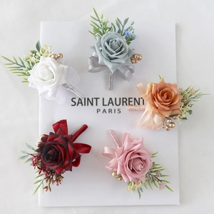 Elegant set of artificial rose boutonnieres with silk ribbons in five assorted colors