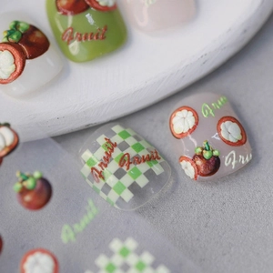 3D mangosteen themed nail art stickers with fruit patterns and green checkerboard designs