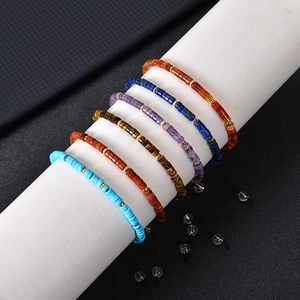 Detailed macro shot of bohemian 4mm natural stone beaded bracelets with adjustable cords