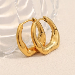 Detailed close-up of shiny 18K gold-plated irregular drop-shaped stainless steel earrings