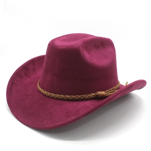 Macro detail of wide-brimmed suede fedora featuring brown braided band and side tassel