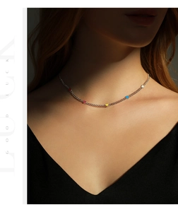 Close-up of s925 sterling silver choker necklace with colorful heart-shaped charms on neck