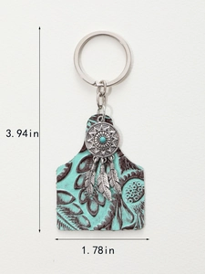 Detailed view of vintage keychain with turquoise stone and brown embossed leather