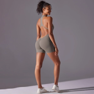 Close-up of olive green backless yoga romper with scrunch butt lifting detail