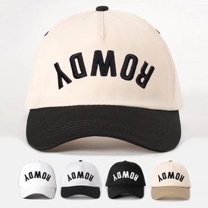 Detail of color-block baseball caps with ROWDY embroidery and adjustable vintage style