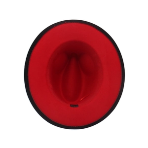Detail of red and black gradient wool felt jazz fedora with smooth texture