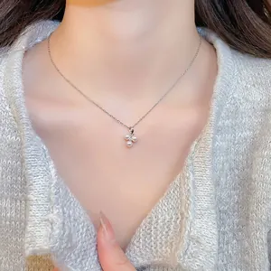 Elegant stainless steel necklace featuring a zircon and triple pearl pendant on a silver chain
