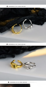 Macro detail of textured silver and gold rings with micro-set zircon on dark background