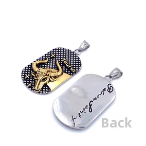 Front and back detail of a Taurus zodiac pendant in gold and silver stainless steel