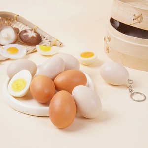 Realistic artificial boiled egg set with keychain ring and bamboo steamer display