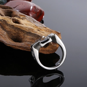 Men's vintage stainless steel cross ring in silver on natural stone background