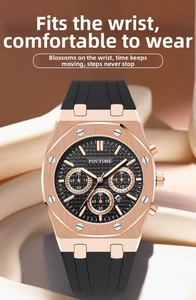 Detail of rose gold multifunctional chronograph watch with black dial and rubber strap