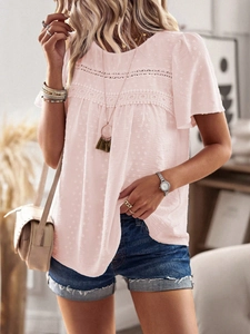 Detail of pink crewneck top with delicate dot texture and elegant lace trimming