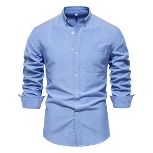 Detail of light blue Oxford shirt featuring grey contrast collar and shoulder stitching