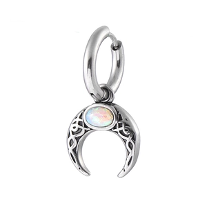 Detail of 316L stainless steel moon earring with opal stone and vintage hollow pattern