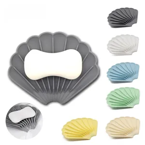 Shell-shaped silicone soap dish shown in six colors with drainage detail