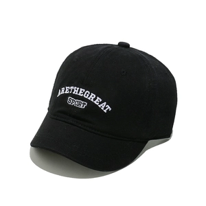 Close-up of white ARETHEGREAT letters embroidery on black cotton baseball cap