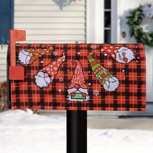 Close-up of Christmas mailbox cover with gnome characters and red buffalo plaid pattern