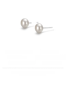 Macro shot of 925 silver studs with high-quality natural freshwater pearls and engraving