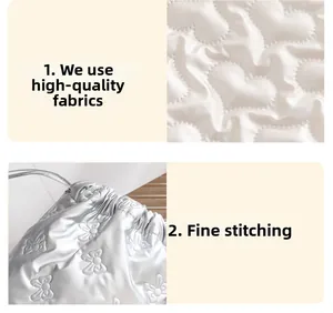 Detailed view of quilted butterfly pattern and heart stitching on premium shiny PU fabric