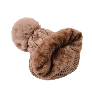 Women's cable knit warm winter beanie with faux fur pom in dark coffee brown color