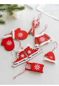 Detailed view of red and white wooden Christmas ornaments with plush edges and snowflake motifs