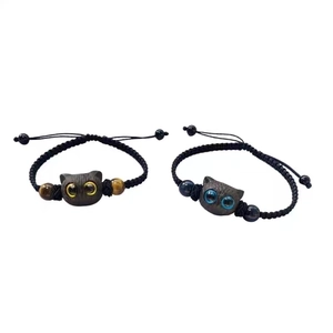 Cute black cat couple woven bracelets with tiger eye stones on white background