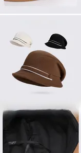 Detail of adjustable inner drawstring and contrast stripes on knit bucket hats