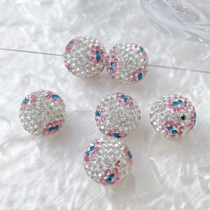 Detailed macro of flower crystal encrusted beads for DIY jewelry making sets