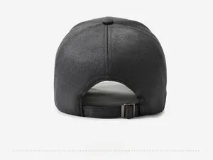 Detail of dark grey baseball cap showing cotton fabric texture and metal adjustable buckle