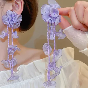Purple chiffon flower tassel earrings with beaded strands for a romantic vacation look
