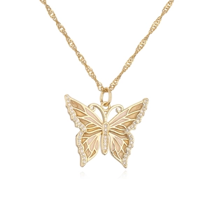 Macro detail of 18K gold-plated butterfly pendant with pink enamel and zircons