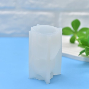 Translucent lucky cat silicone mold for DIY candles and soaps on light blue countertop