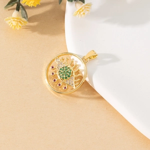 Detailed close-up of a golden Evil Eye pendant with green and red crystals