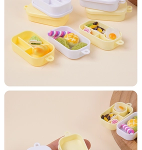 Miniatuur bento box set met realistische voedselmodellen en handformaat vergelijking