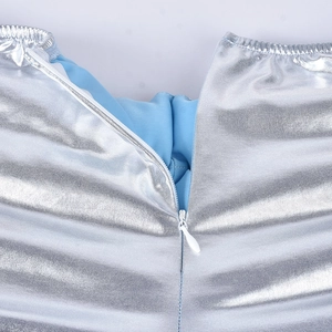 Detail of silver water-resistant fabric with blue lining and hidden zipper closure