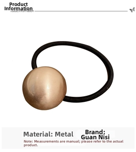Detail of minimalist elastic hair tie featuring a polished gold metallic spherical bead